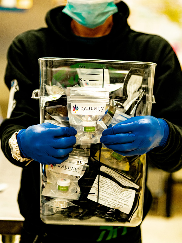 Kabunky-worker-packaged-cannabis-concentrates